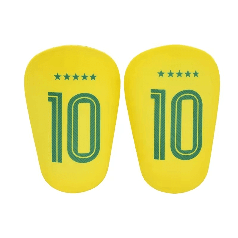 Pair of yellow shin guards with the number 10 and five stars printed in green.